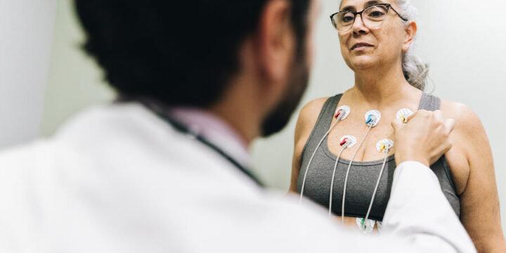 Patient talking with their doctor during a cardiopulmonary stress test on a hospital