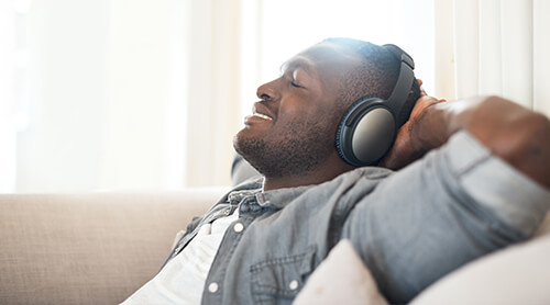 Person listening to music on headphones