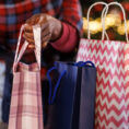 Person looking through holiday shopping bags