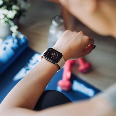 close up of person's arm using a fitness tracker