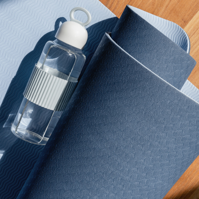 Close up of yoga mat and water bottle