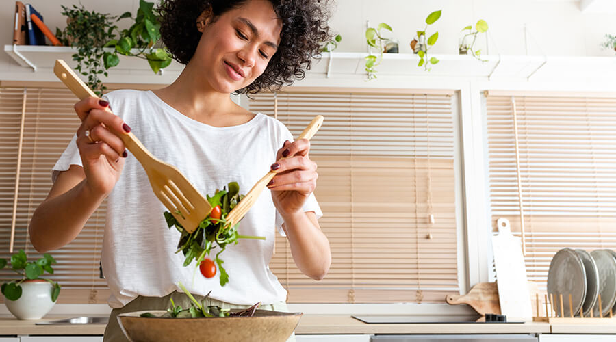 Woman tossing a salad