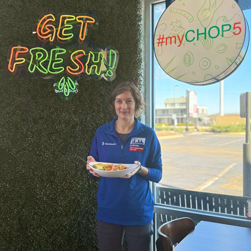 Dawn holding the capcity offical runner's bowl from chop5