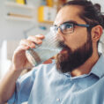 Man taking a drink of water