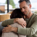 Husband comforting grieving wife