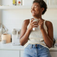 Woman enjoying morning coffee in kitchen