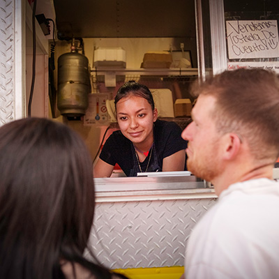 Couple ordering food at food truck
