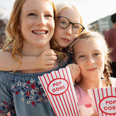Group of kids eating popcorn