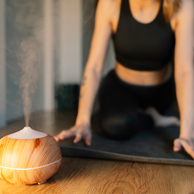 Woman doing workout by humidifier