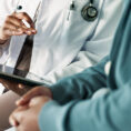doctor sharing news with patient