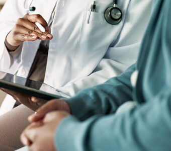 doctor sharing news with patient