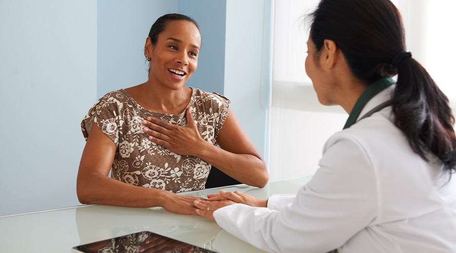 Woman having conversation with doctor