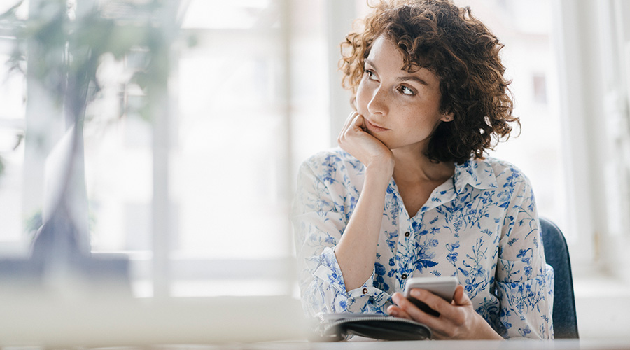 Woman reflecting and journaling