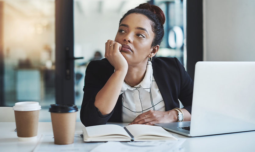 Woman stuggling to do her work, stressed, tired