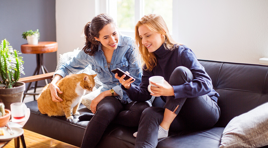 Two women looking at phone