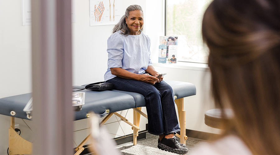 Woman smiling at her doctor